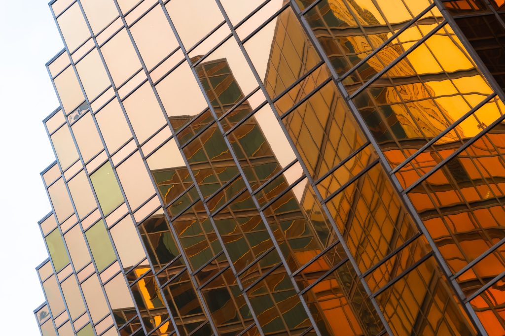 Office buildings windows. Glass architecture facade design with reflection